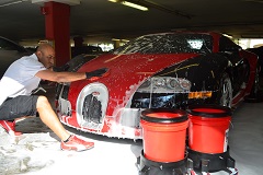 A professional hand wash utilizing Microfiber washing mitts and wheel brushes