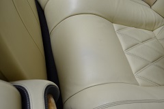 Multiple professional color-matching paint applications to the leather surface